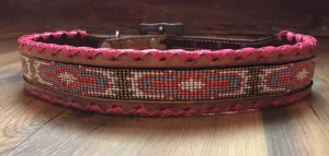Genuine leather dog collar with pink, white, and gold navajo beaded inlay design, a rawhide wrapped edge