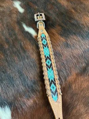 Genuine leather dog collar with teal, white, and black navajo beaded inlay design, a leather wrapped edge